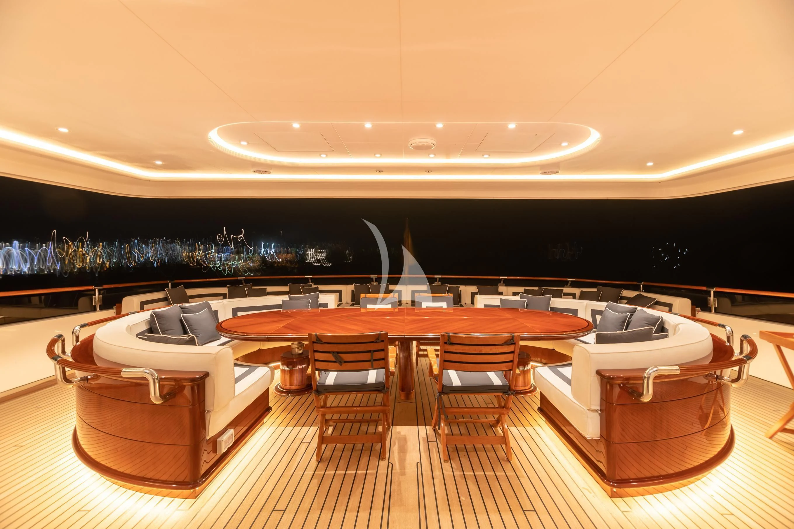 a room with a table and chairs aboard AQUA MARE Yacht for Sale