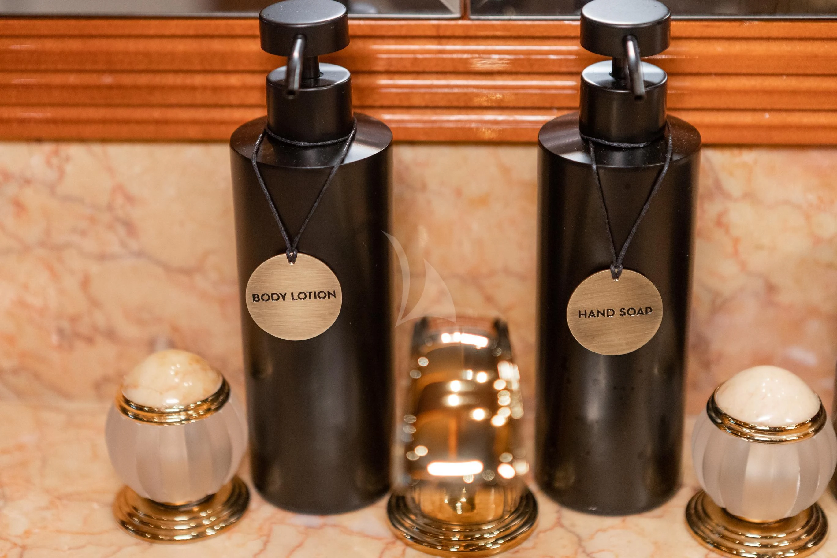 a group of perfume bottles aboard AQUA MARE Yacht for Sale