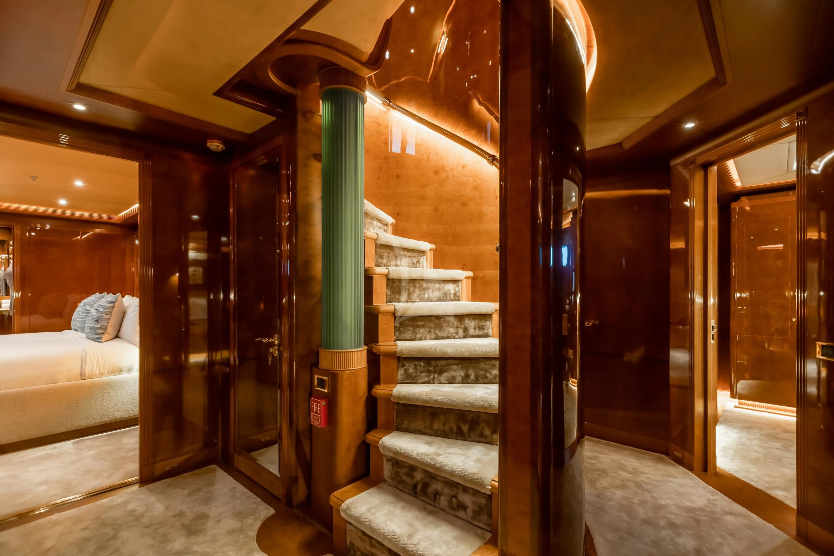a room with a staircase and a couch aboard AQUA MARE Yacht for Sale