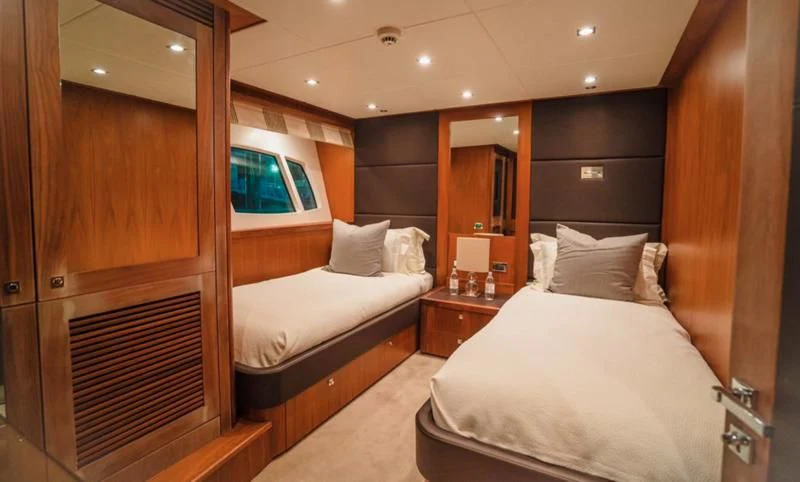 a room with two beds aboard LUCIEN Yacht for Sale