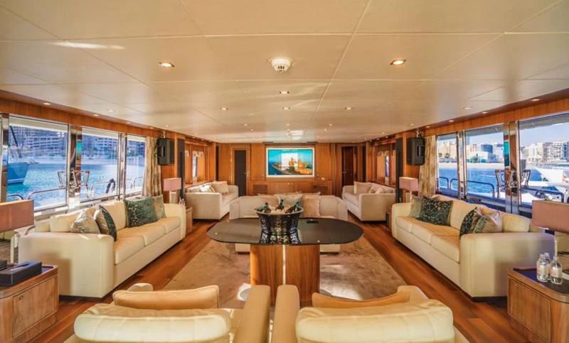 a living room with a large window aboard LUCIEN Yacht for Sale