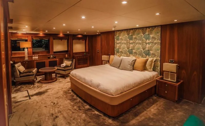a large bed in a hotel room aboard LUCIEN Yacht for Sale