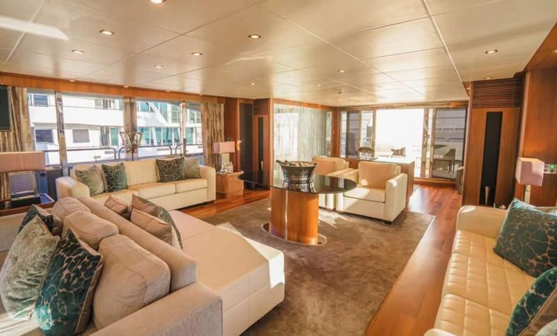 a living room with a large window aboard LUCIEN Yacht for Sale