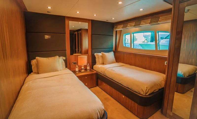 a room with a bed and a mirror aboard LUCIEN Yacht for Sale