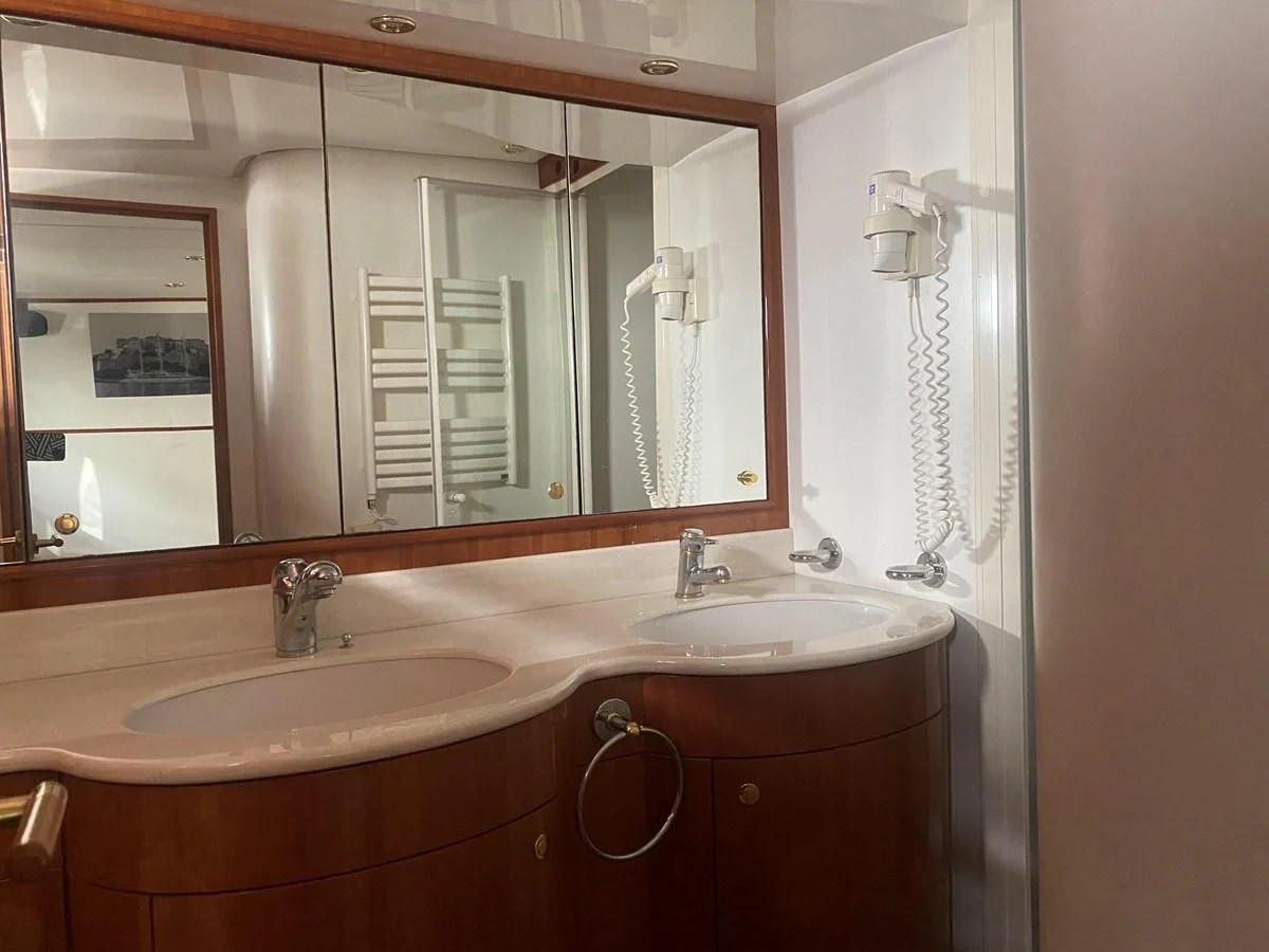 a bathroom with two sinks aboard AMADEUS Yacht for Sale