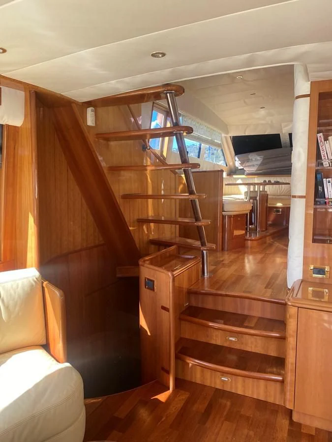 a wooden staircase with a glass door aboard AMADEUS Yacht for Sale
