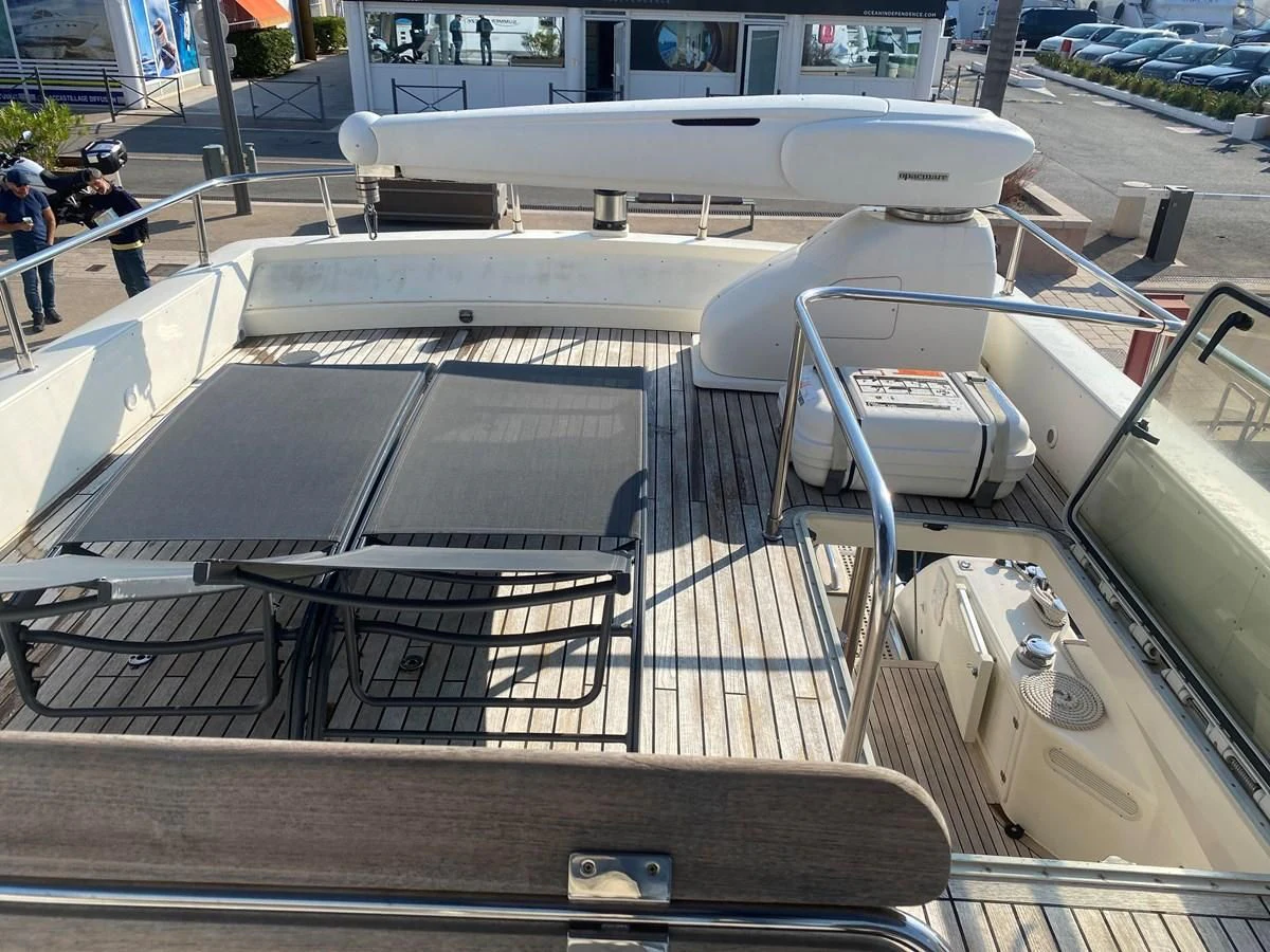 a silver car on display aboard AMADEUS Yacht for Sale