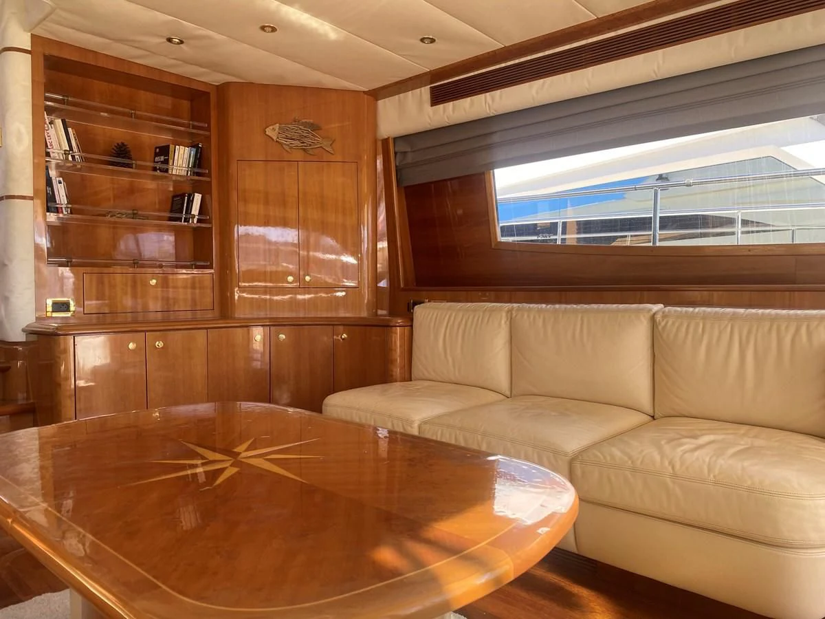 a living room with a table aboard AMADEUS Yacht for Sale