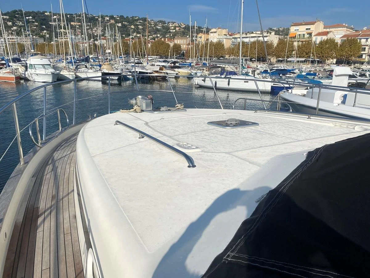 a boat is parked in a harbor aboard AMADEUS Yacht for Sale