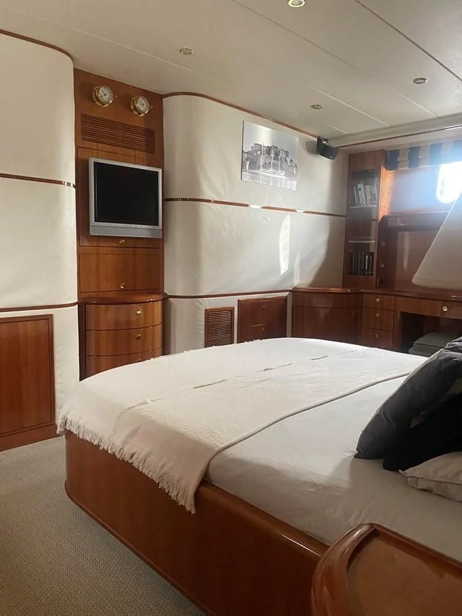 a bed in a room aboard AMADEUS Yacht for Sale