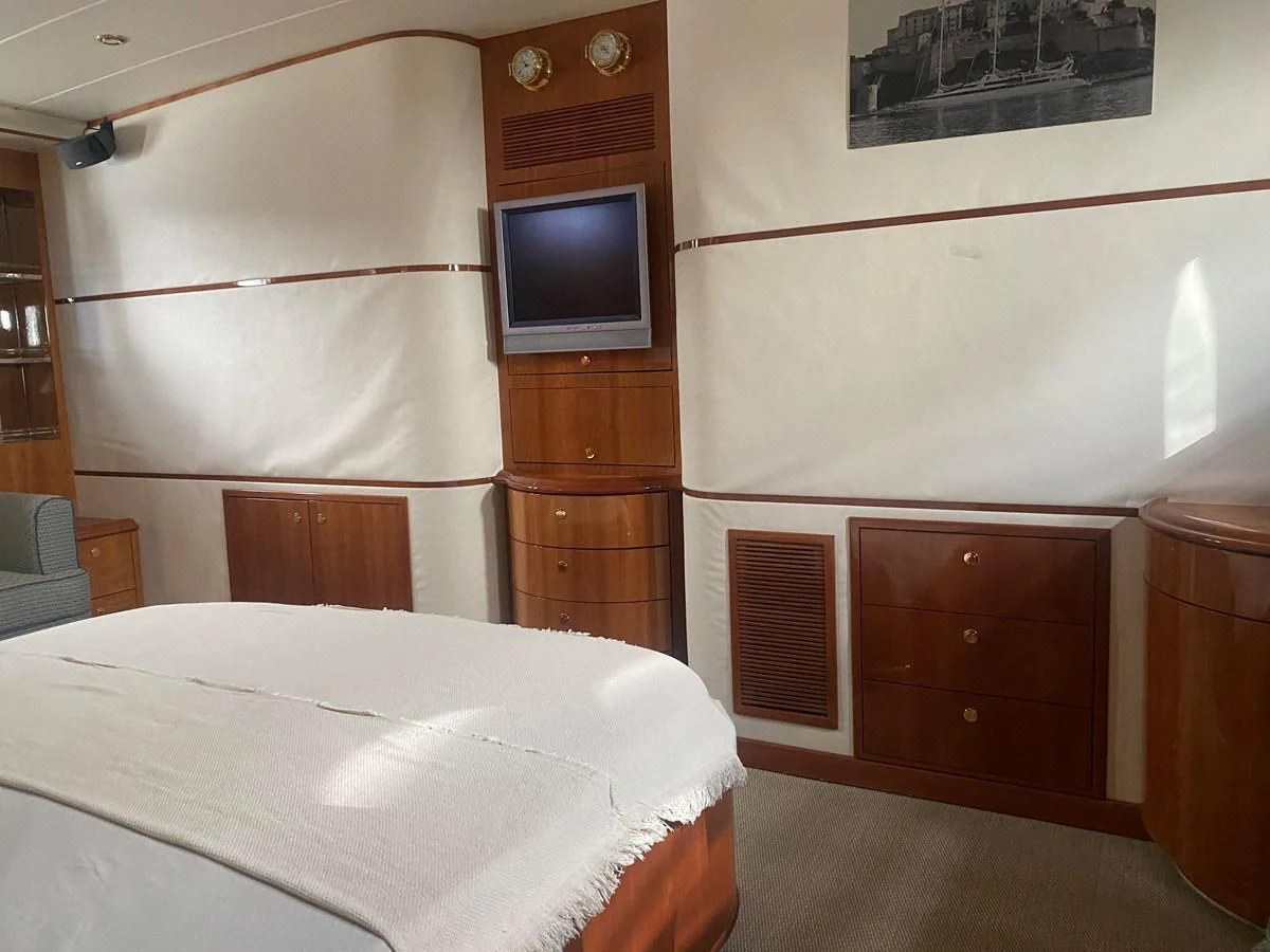 a bed in a room aboard AMADEUS Yacht for Sale