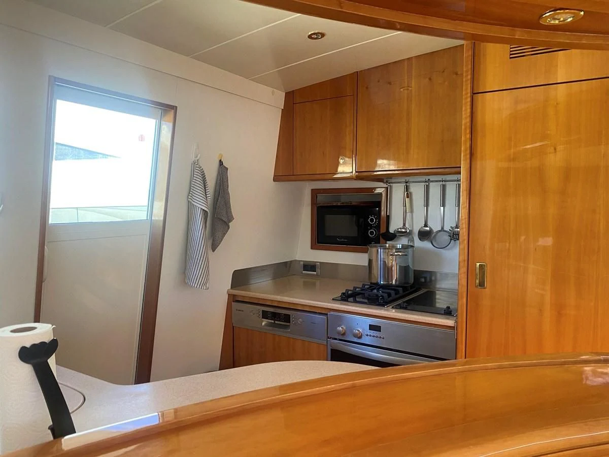a kitchen with a window aboard AMADEUS Yacht for Sale