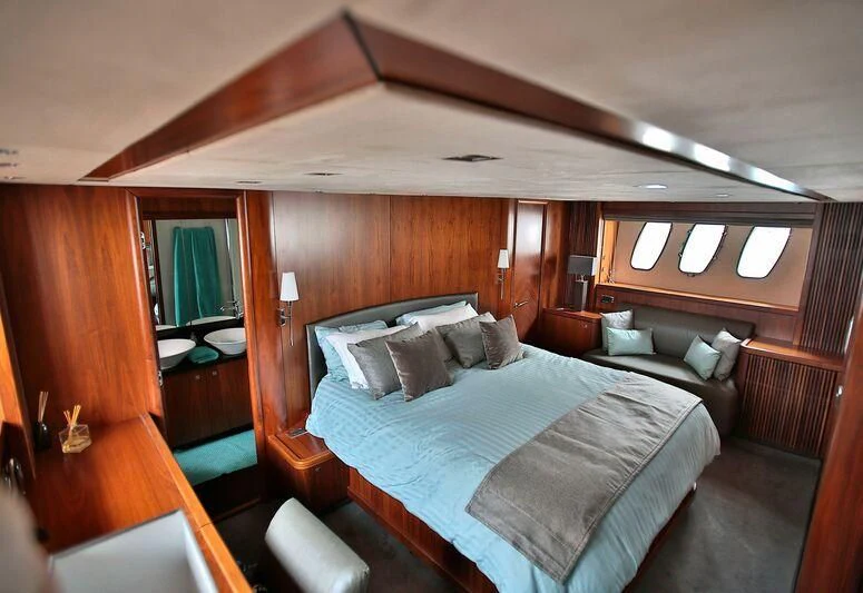 a bed in a room aboard PHOENIX Yacht for Sale