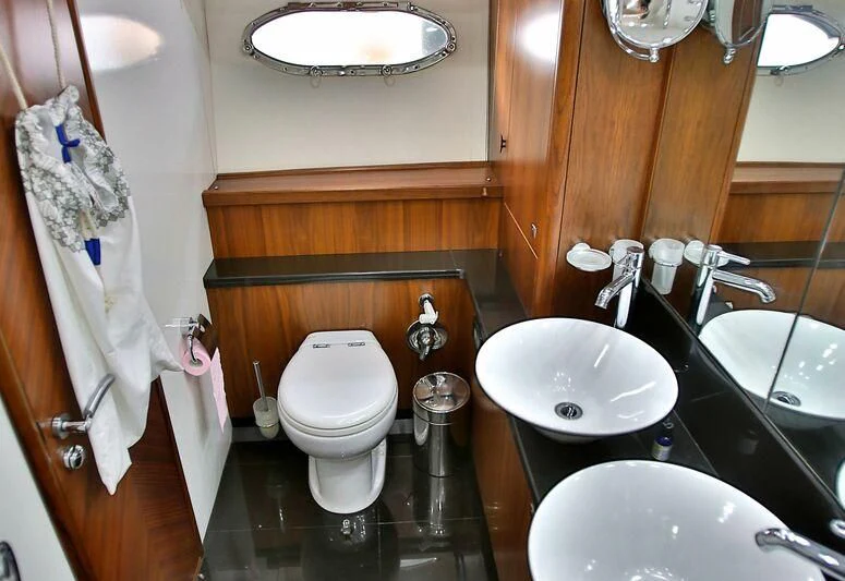 a bathroom with a sink toilet and a bathtub aboard PHOENIX Yacht for Sale