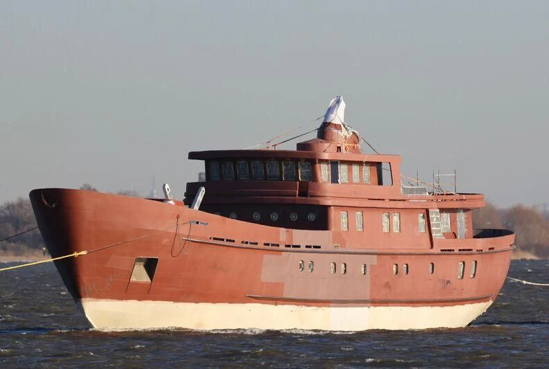 a large boat on the water aboard VEGA Yacht for Sale