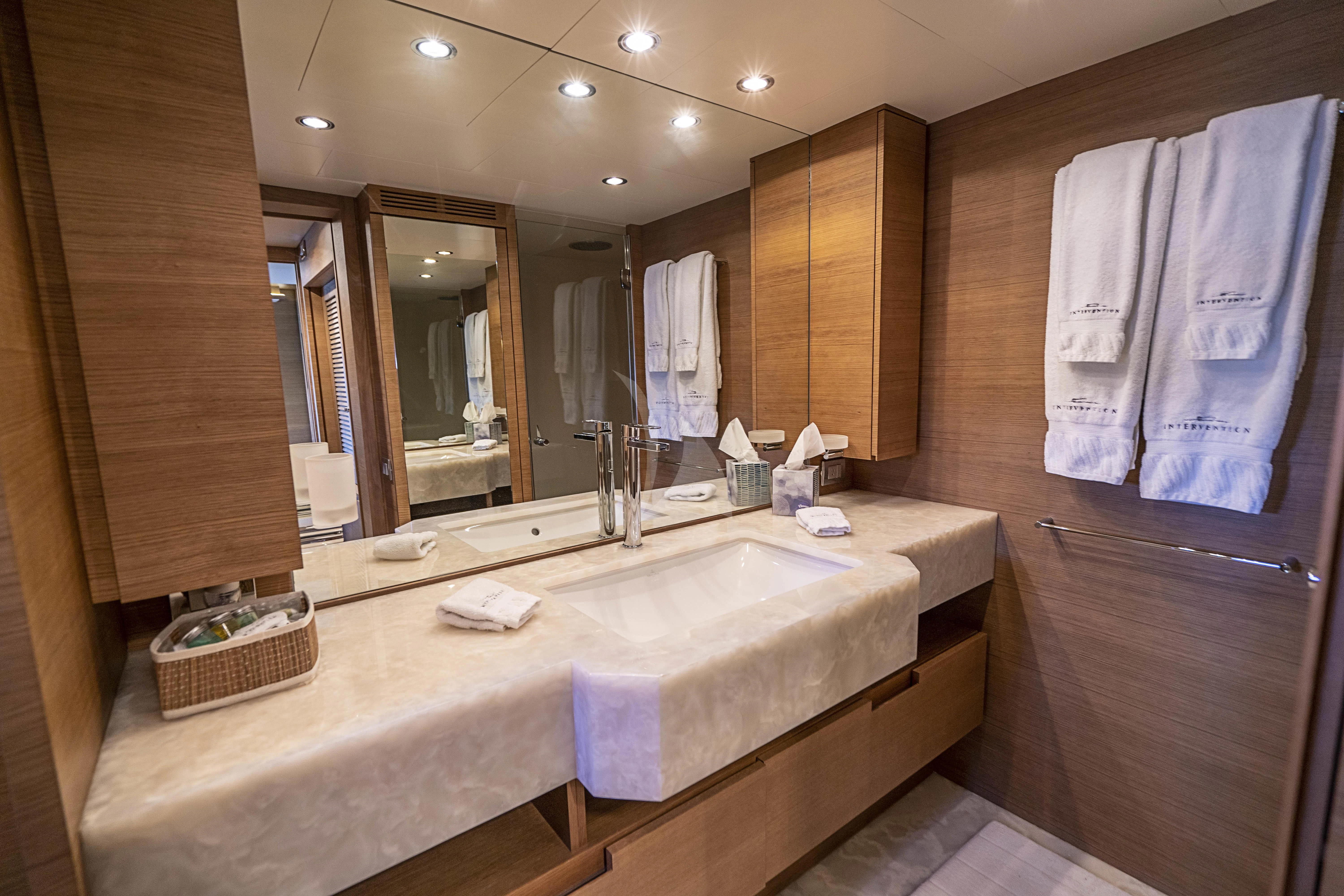 a bathroom with a large mirror aboard INTERVENTION Yacht for Sale