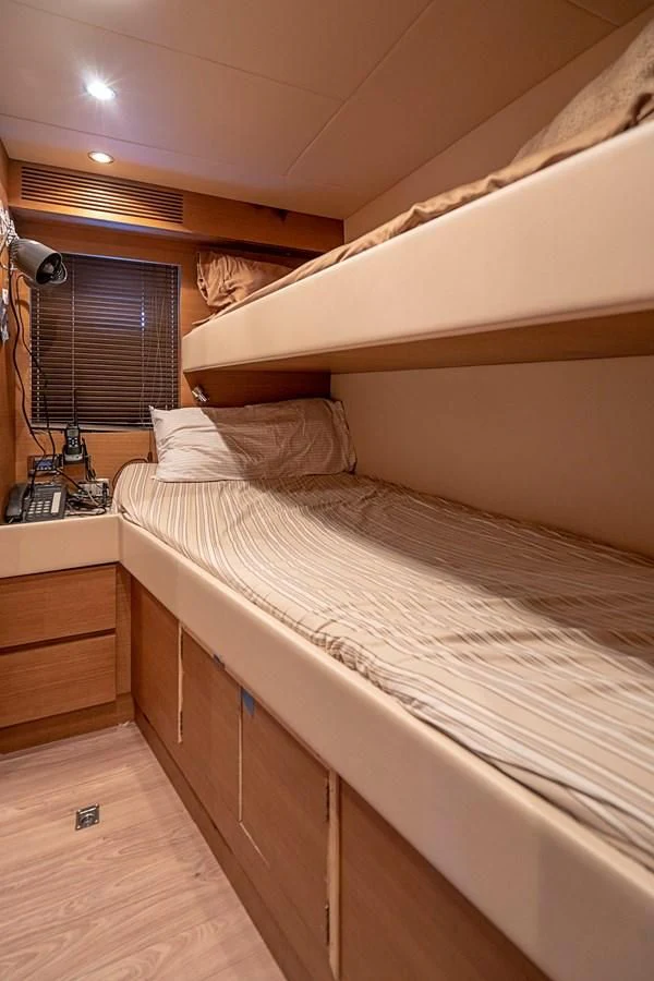 a bed with white sheets aboard INTERVENTION Yacht for Sale