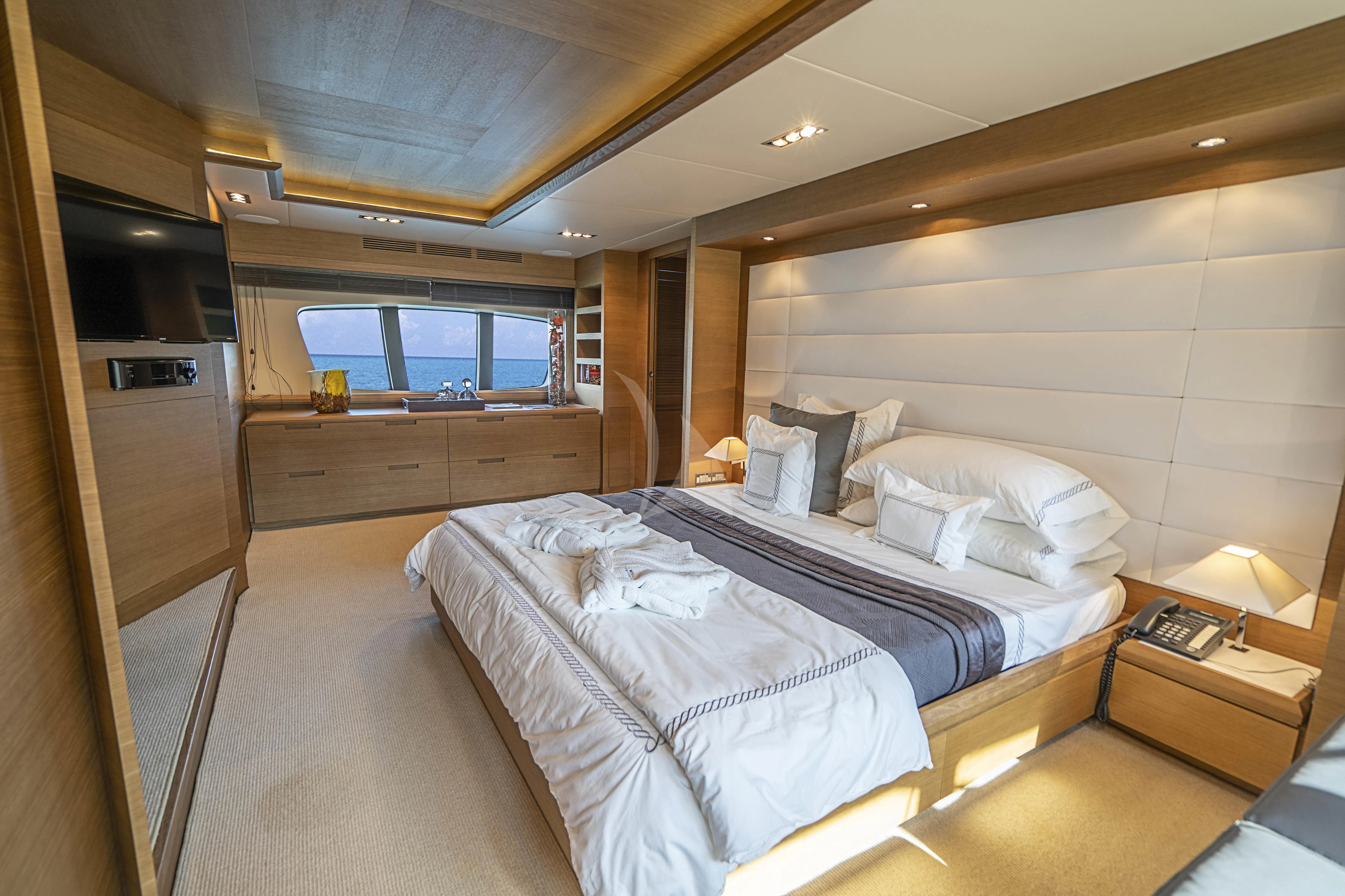 a room with a bed and a tv aboard INTERVENTION Yacht for Sale