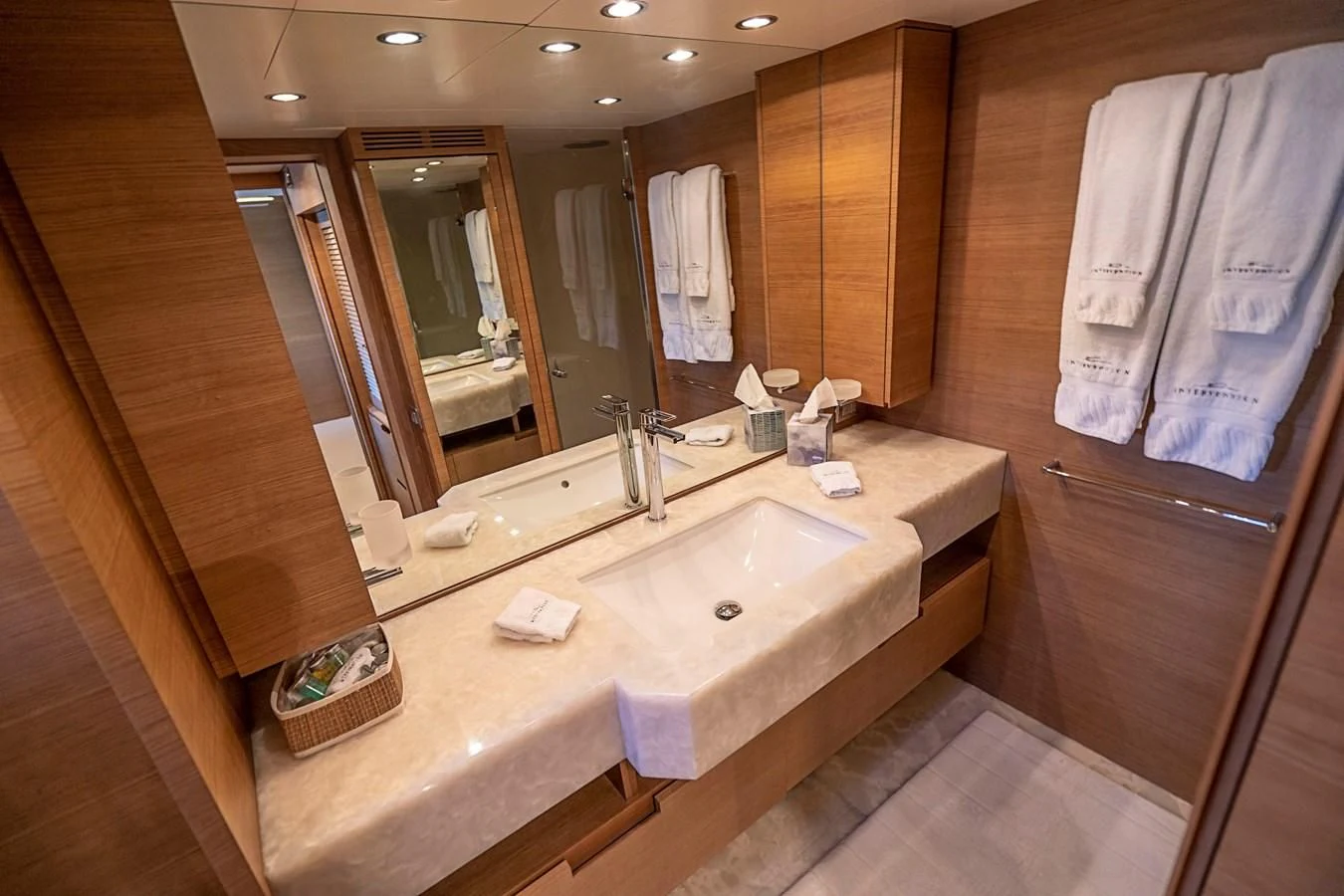 a bathroom with a sink and towels aboard INTERVENTION Yacht for Sale
