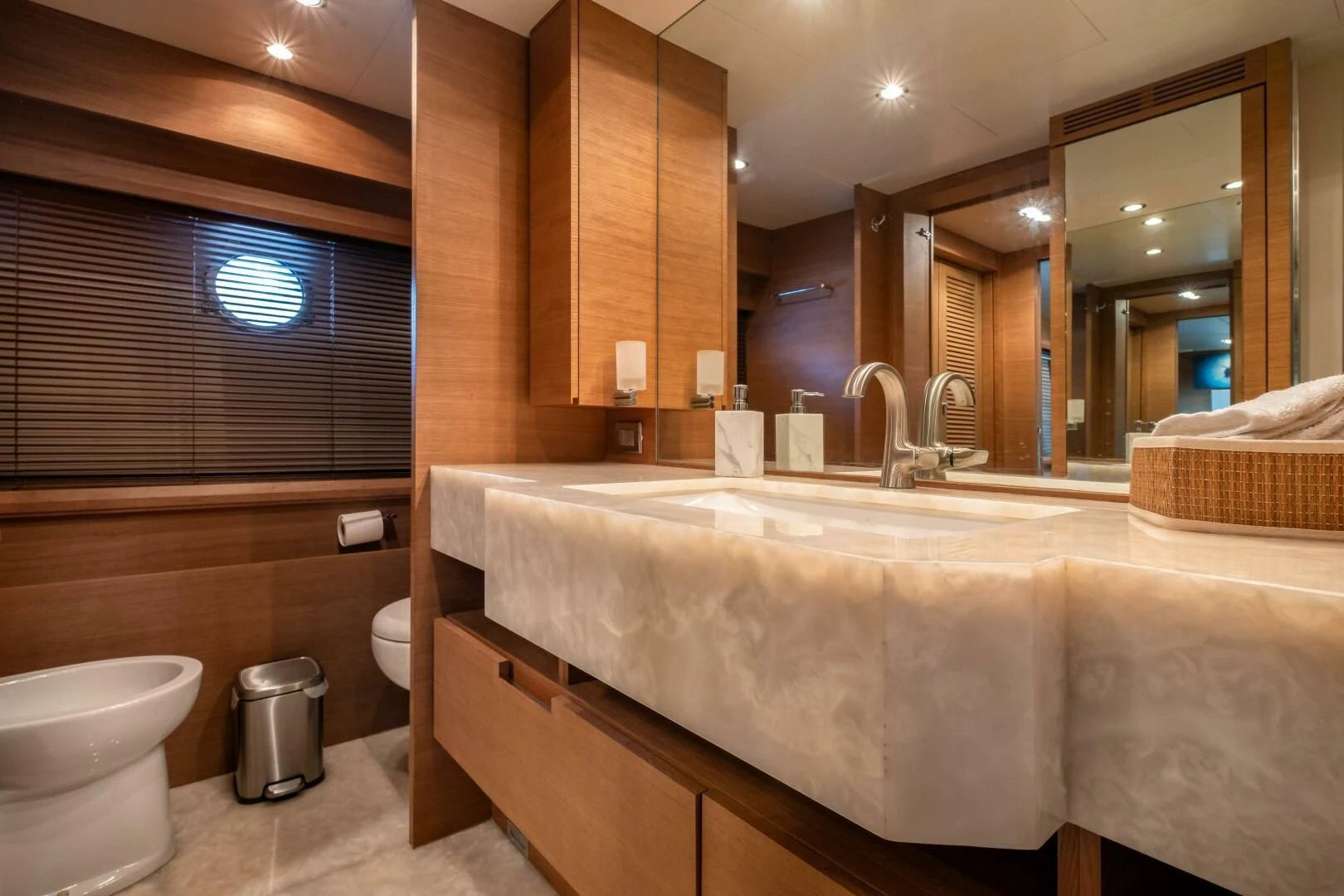 a bathroom with a tub sink and toilet aboard INTERVENTION Yacht for Sale