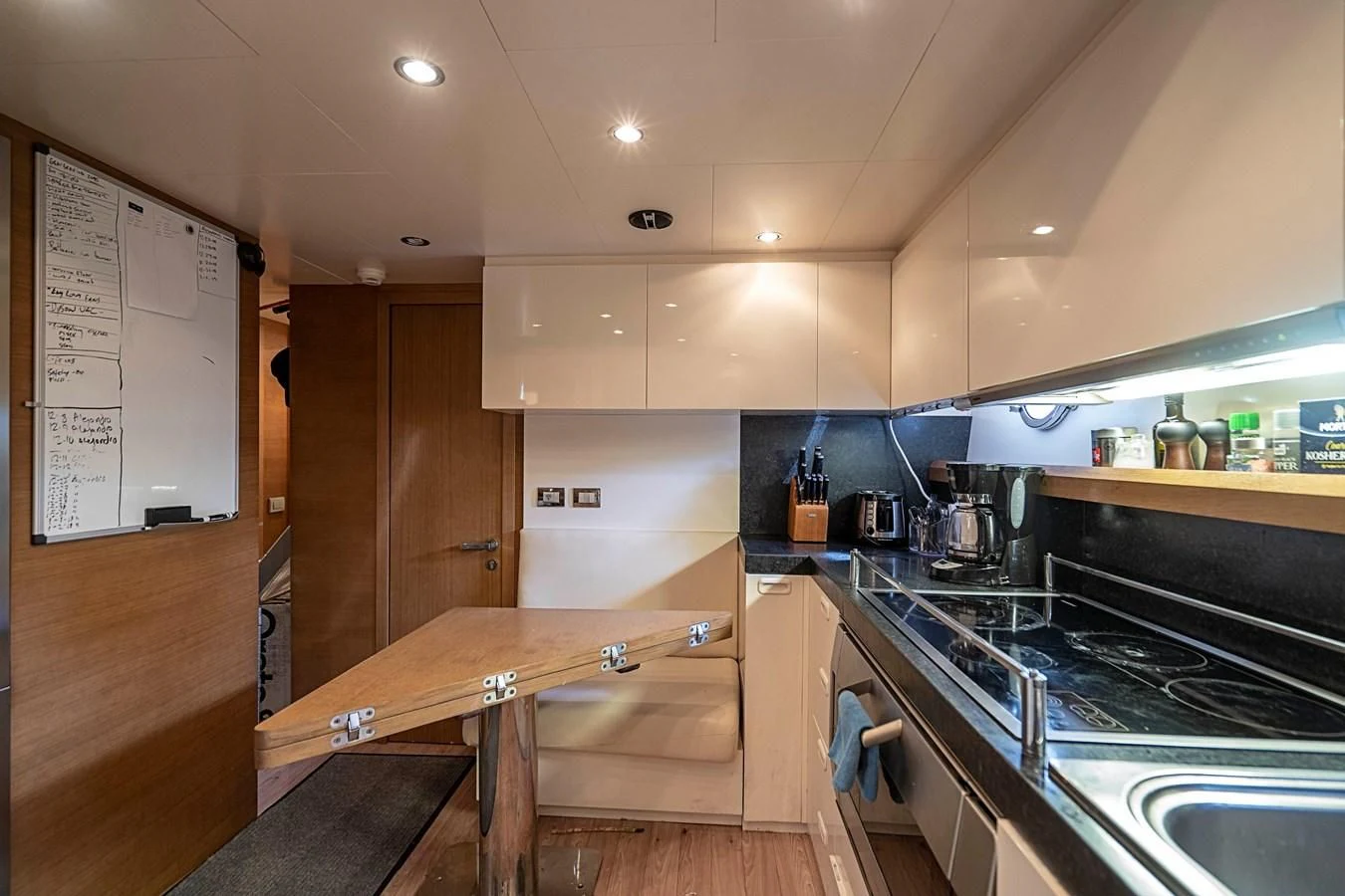 a kitchen with a large island aboard INTERVENTION Yacht for Sale