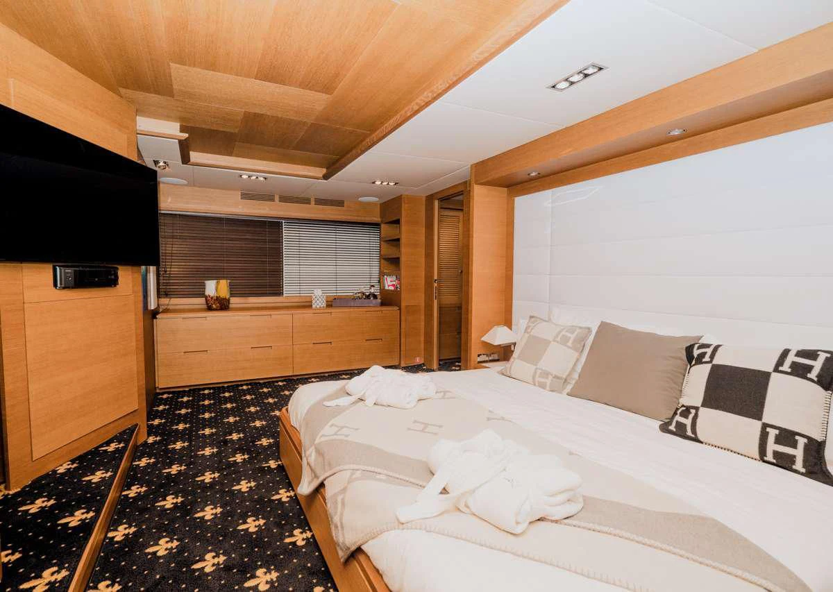 a room with a bed and a tv aboard INTERVENTION Yacht for Sale