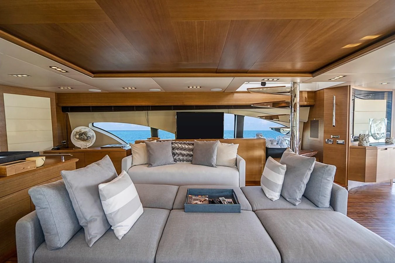 a living room with a large sofa aboard INTERVENTION Yacht for Sale