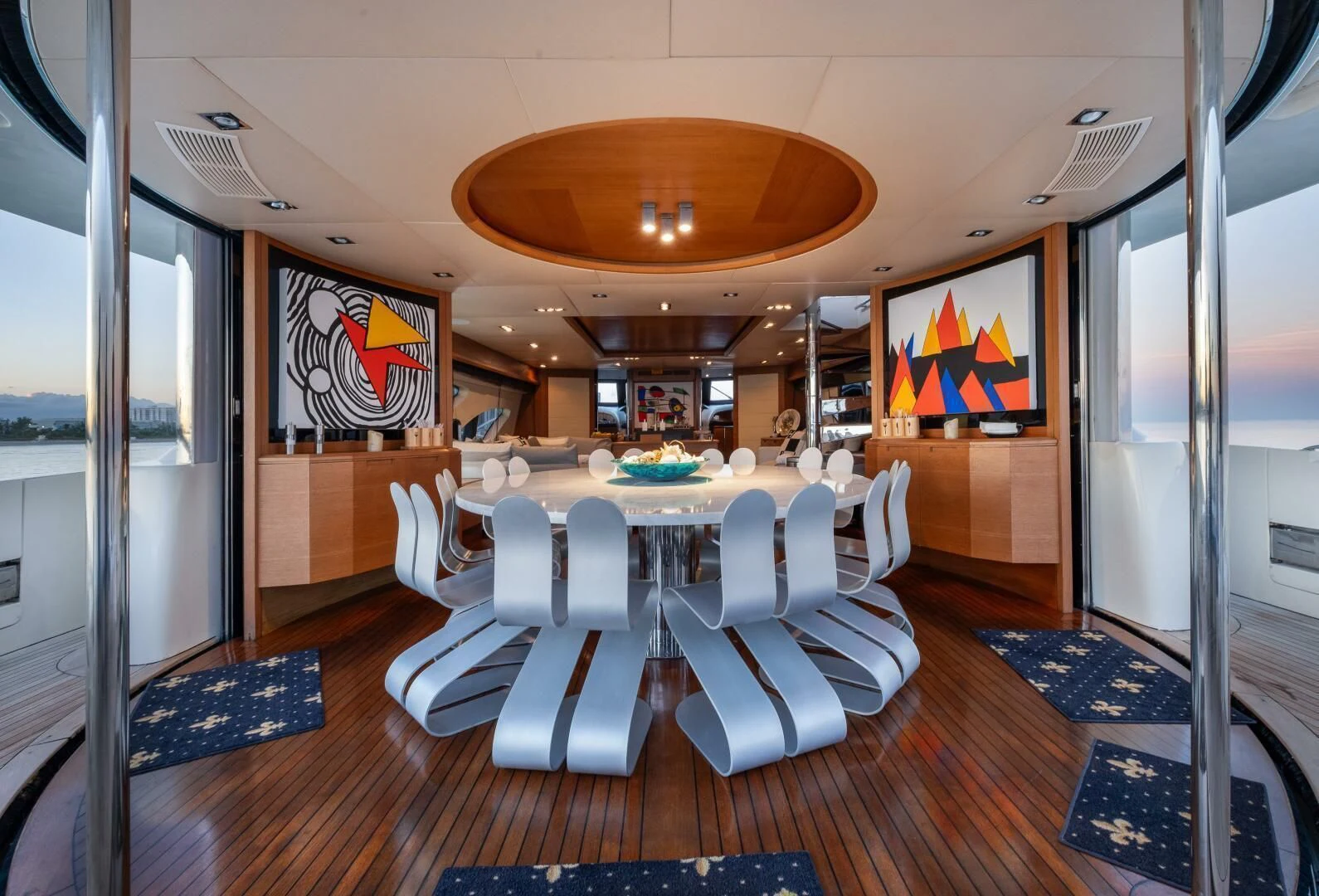a room with tables and chairs aboard INTERVENTION Yacht for Sale