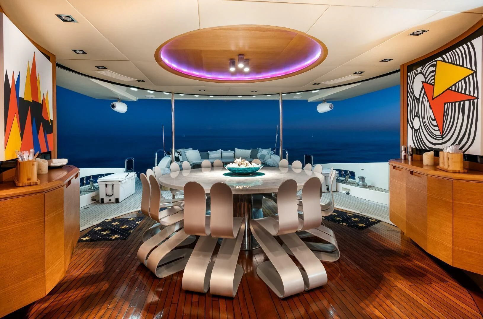 a room with a table and chairs aboard INTERVENTION Yacht for Sale