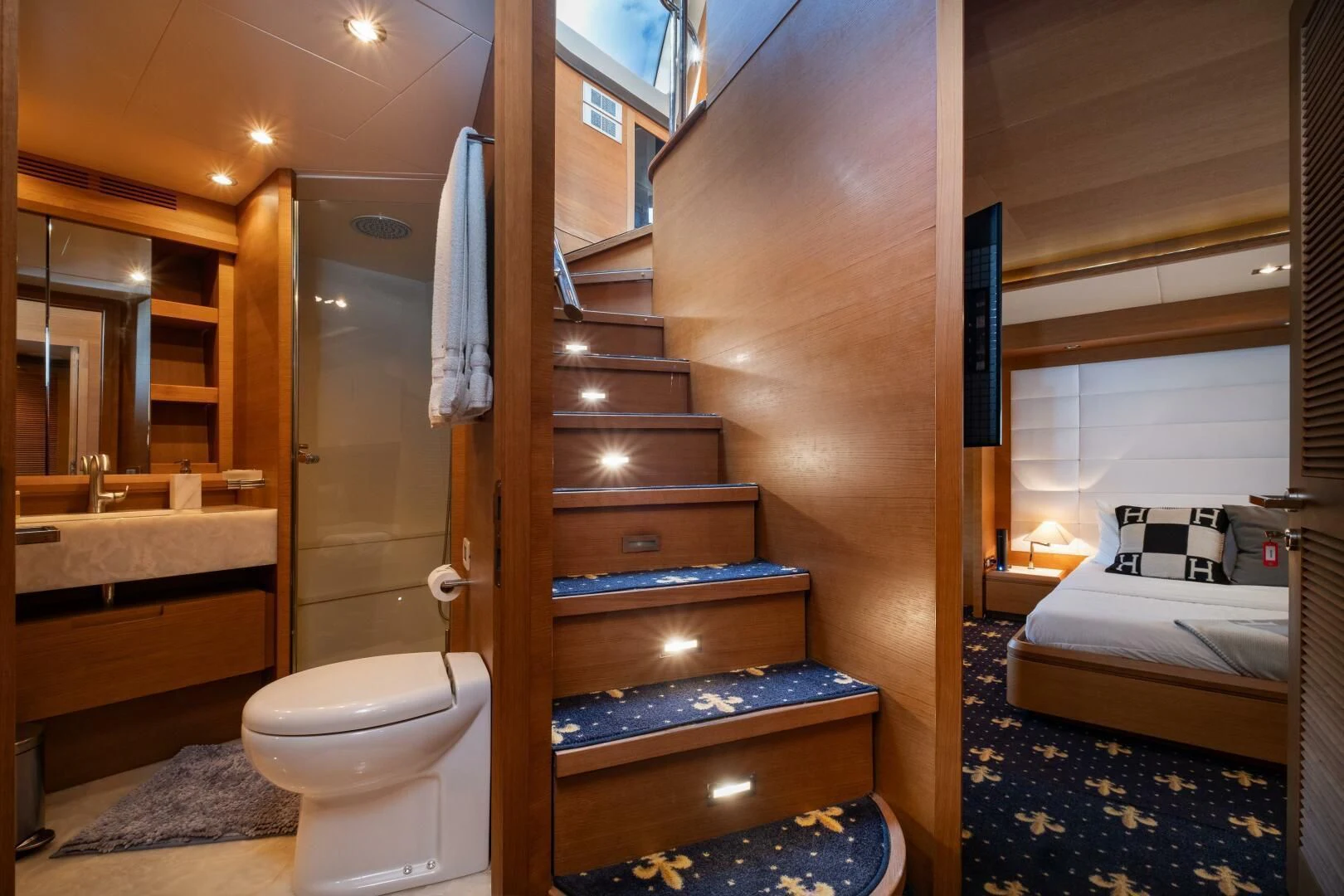 a bathroom with a wood staircase aboard INTERVENTION Yacht for Sale