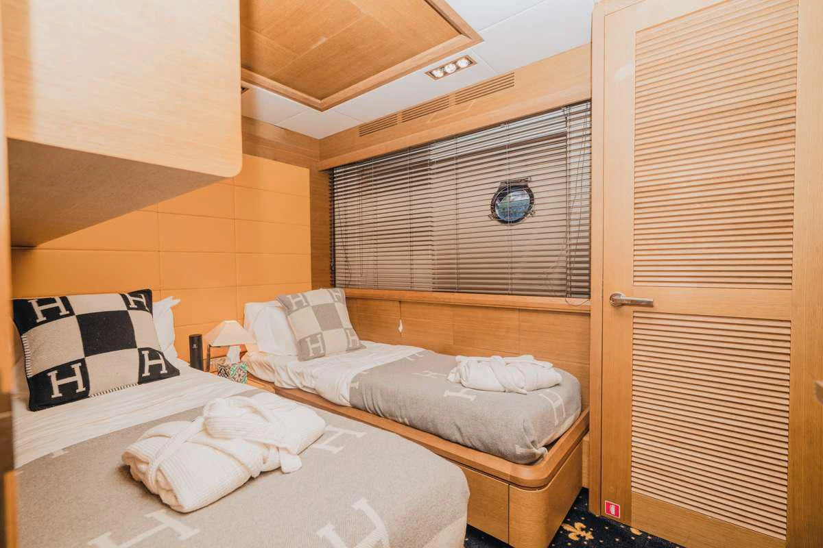 a room with two beds aboard INTERVENTION Yacht for Sale