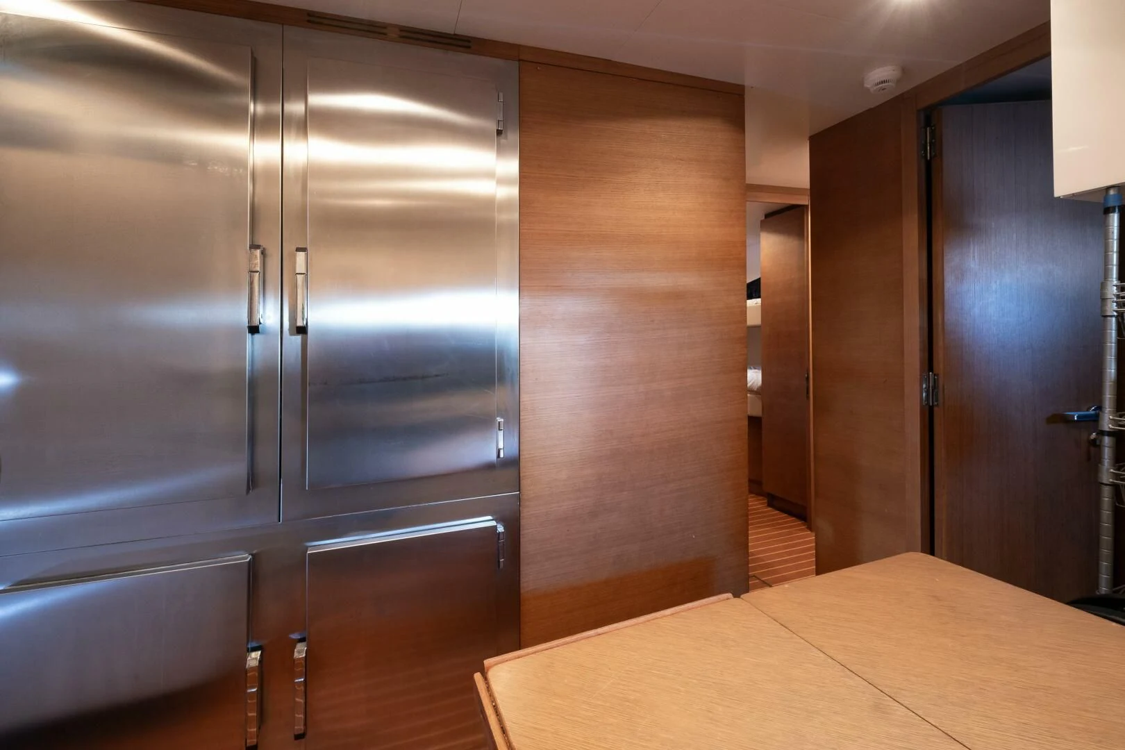 a room with a large refrigerator aboard INTERVENTION Yacht for Sale