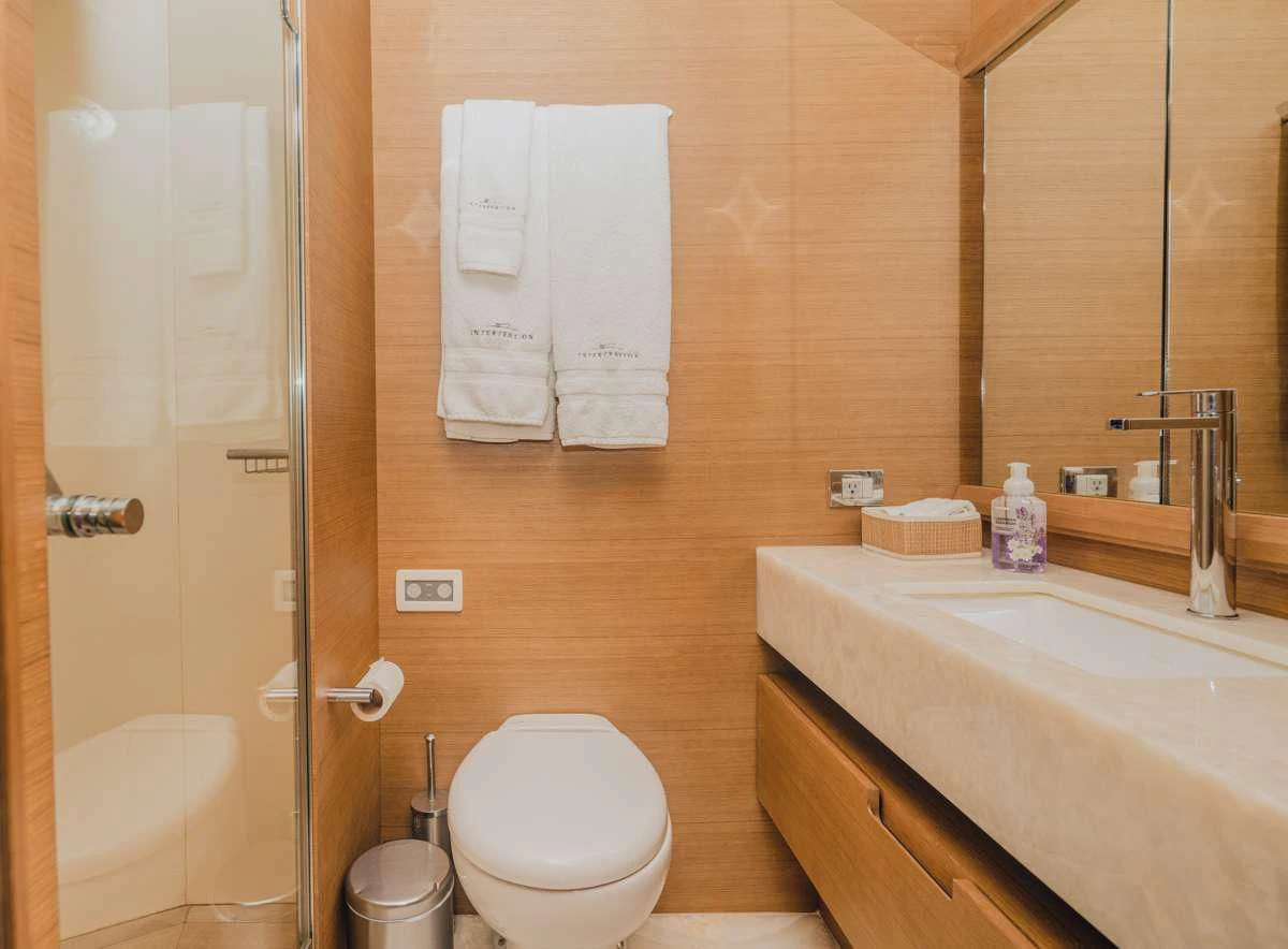 a bathroom with a sink toilet and a bathtub aboard INTERVENTION Yacht for Sale