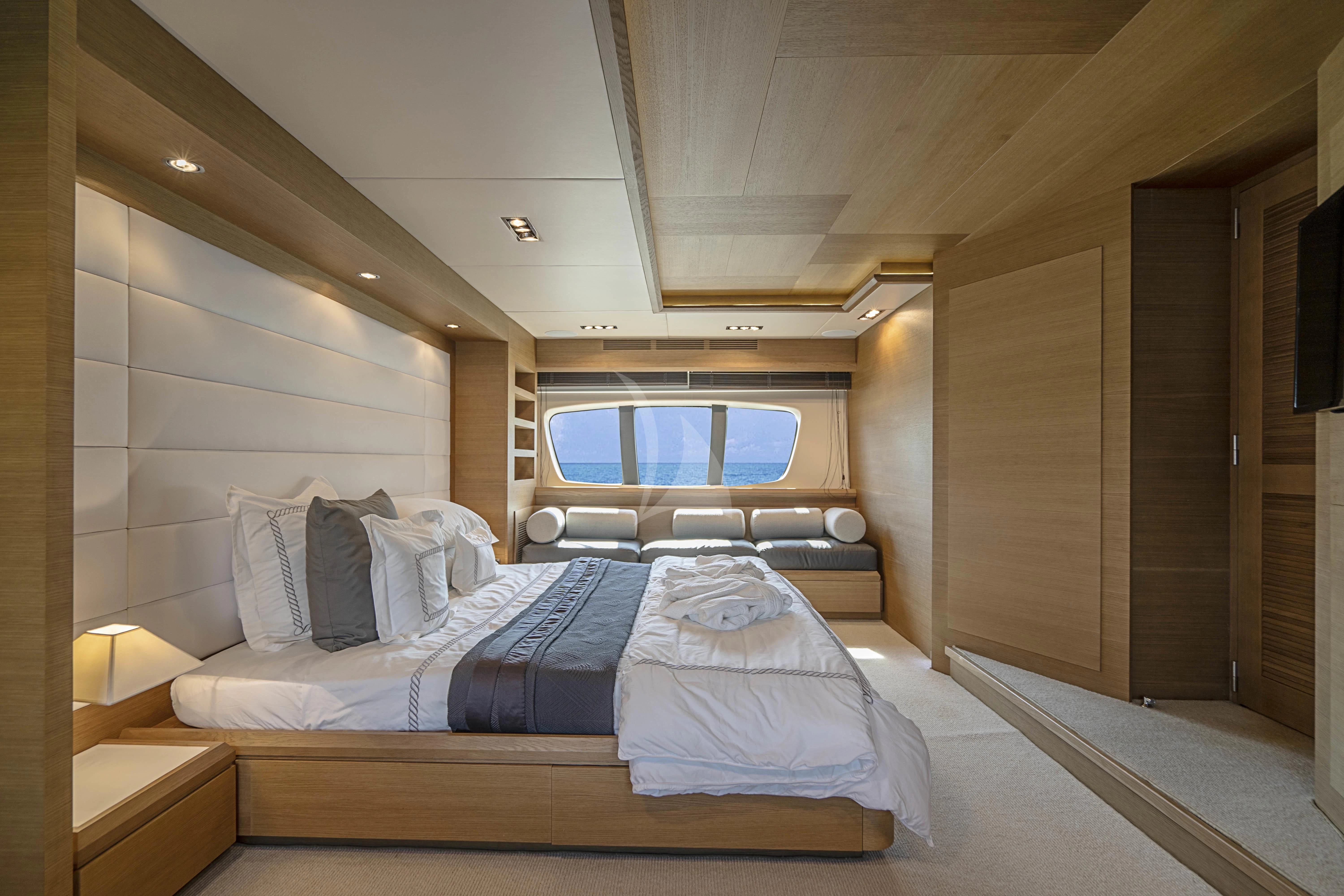 a room with a bed and a window aboard INTERVENTION Yacht for Sale