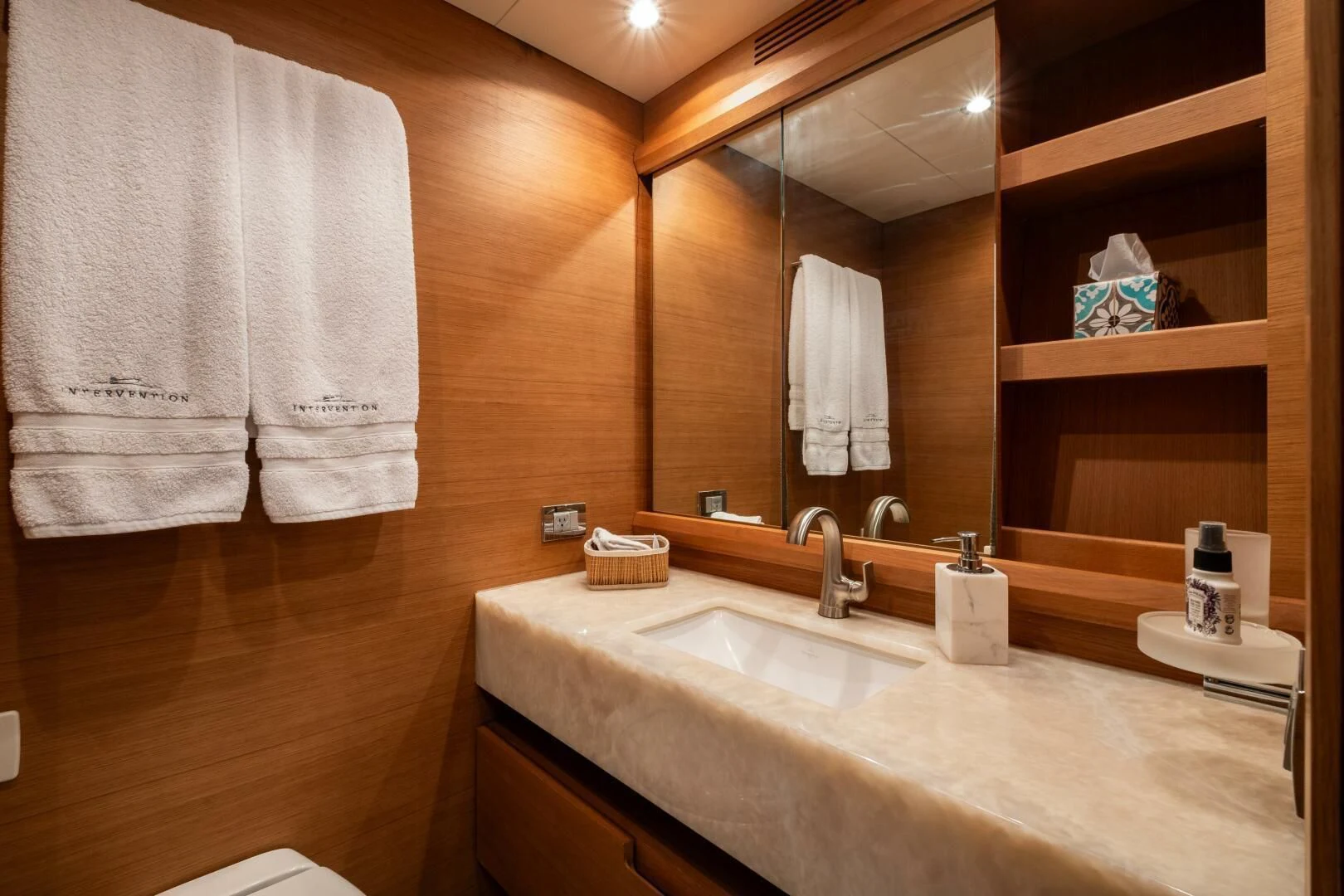 a bathroom with a large mirror aboard INTERVENTION Yacht for Sale