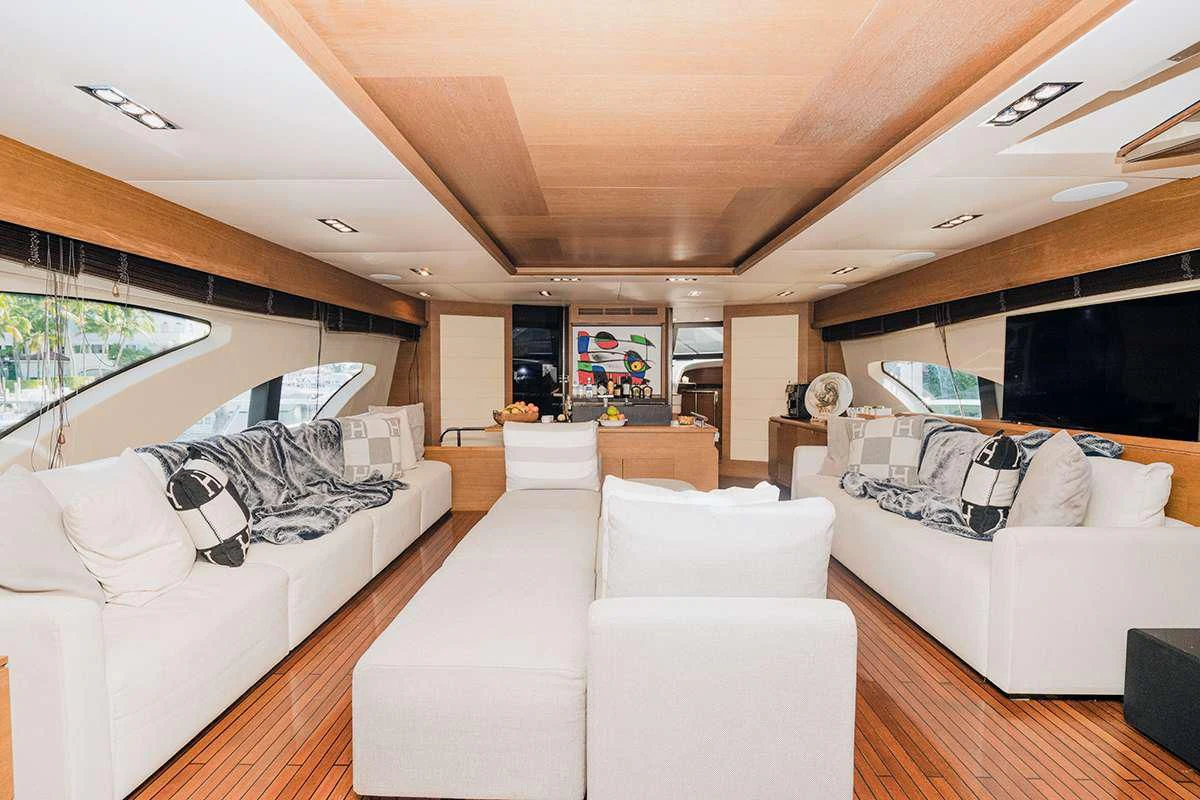 a living room with white couches aboard INTERVENTION Yacht for Sale
