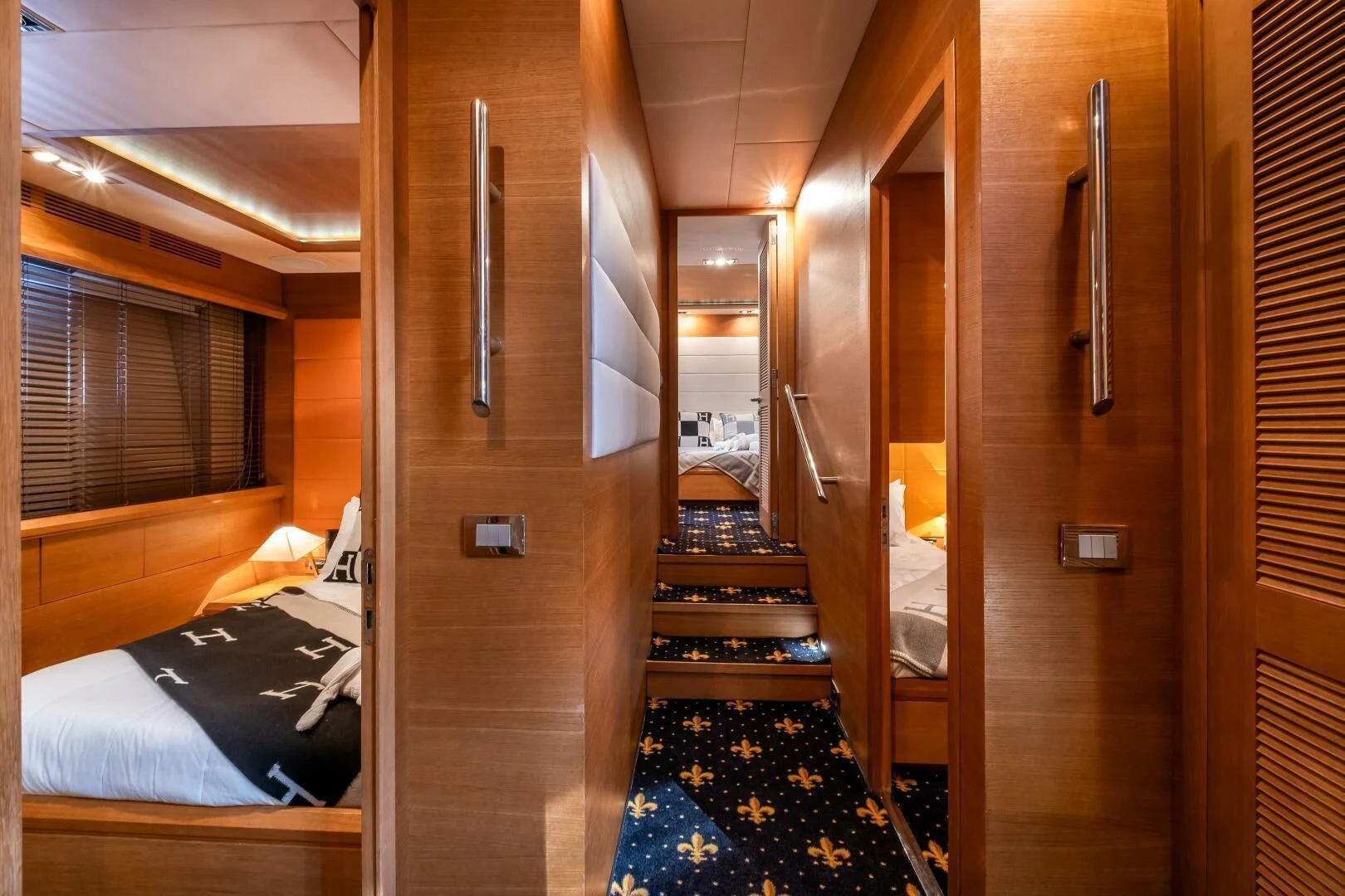a room with a bed and a door aboard INTERVENTION Yacht for Sale