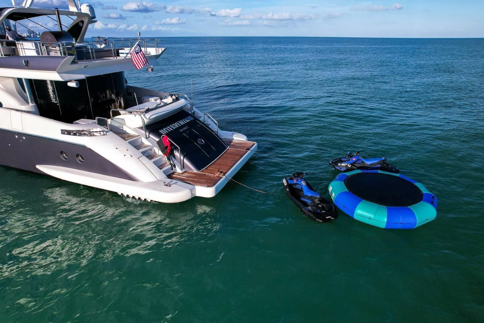 a boat and a small boat in the water aboard INTERVENTION Yacht for Sale