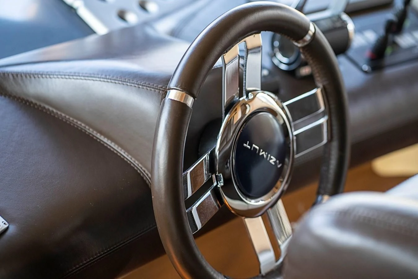 the steering wheel and dashboard of a car aboard INTERVENTION Yacht for Sale