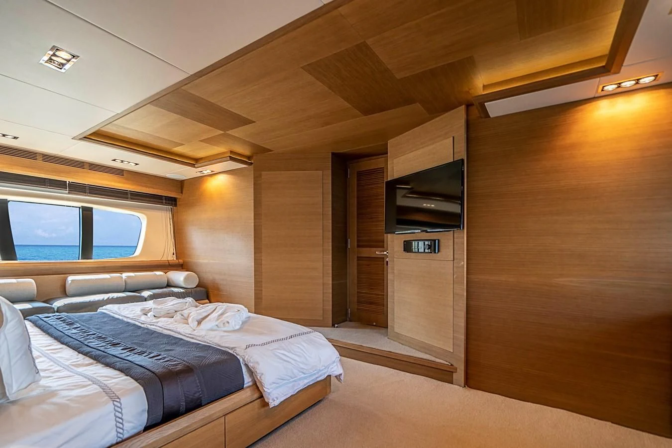 a room with a bed and a television aboard INTERVENTION Yacht for Sale