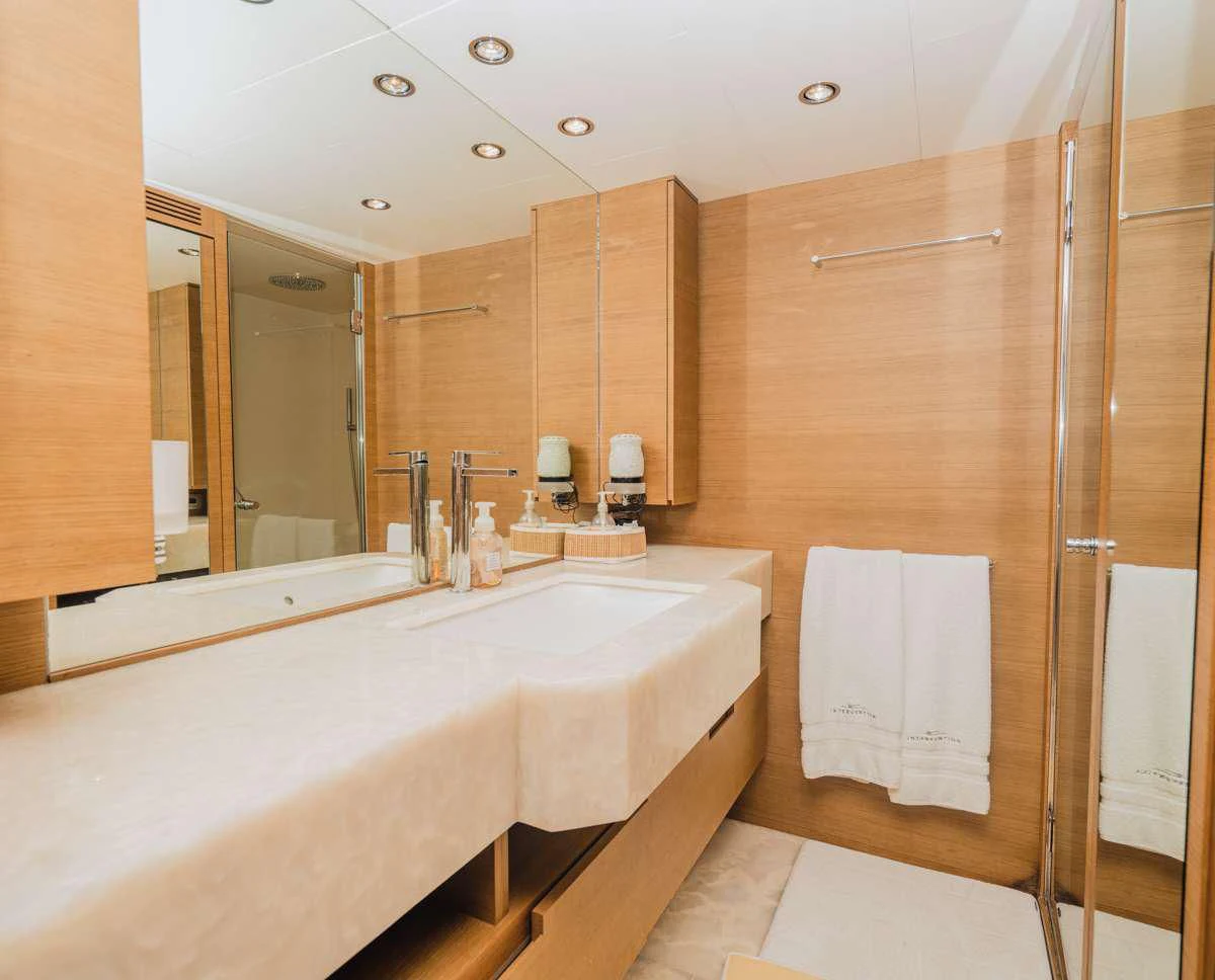 a bathroom with a large mirror aboard INTERVENTION Yacht for Sale