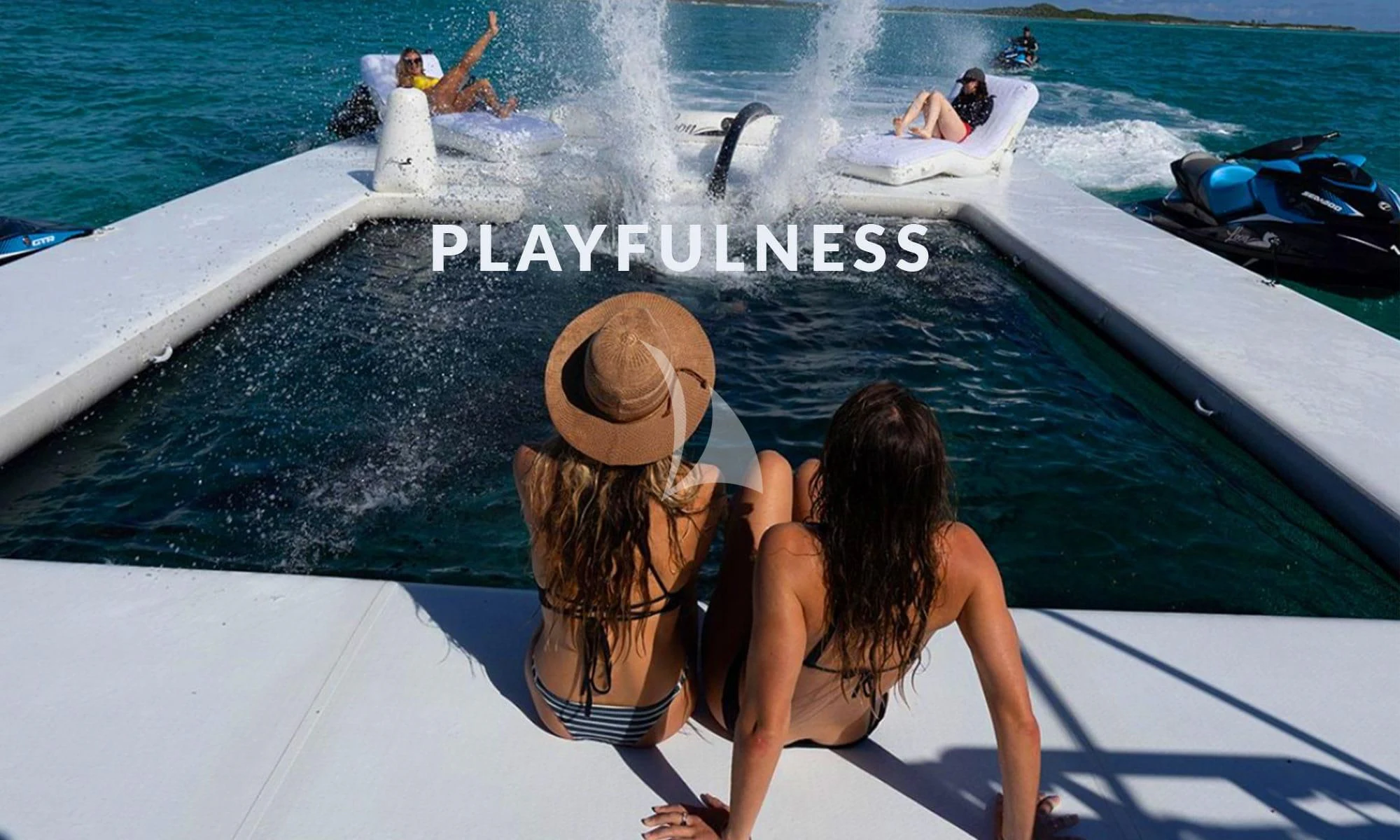 a couple of women sitting on a boat looking at a whale aboard INTERVENTION Yacht for Sale