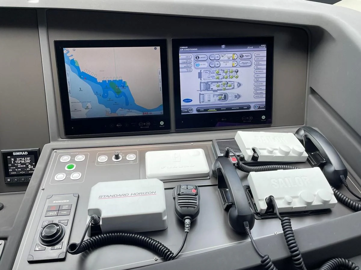 a computer with a screen and other electronics on it aboard CUSTOM LINE 108 Yacht for Sale