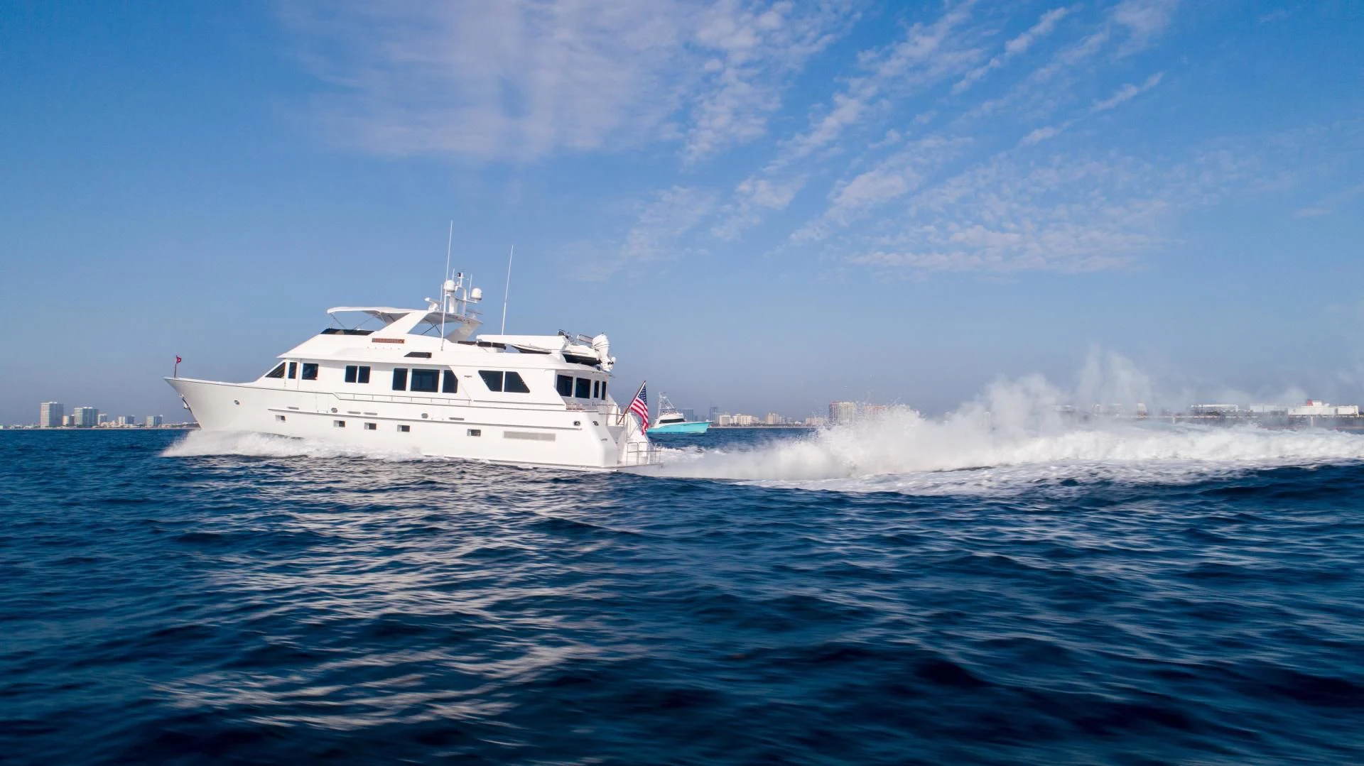 a couple of white boats in the water aboard WELL DONE Yacht for Sale