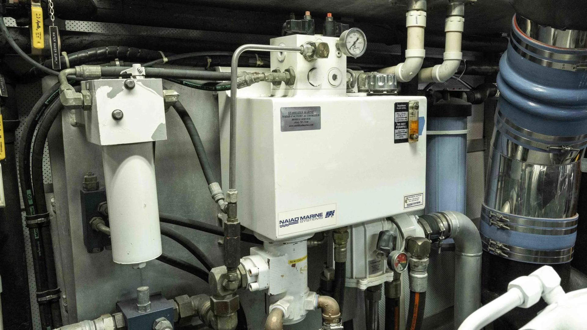 a machine with a large metal cylinder aboard WELL DONE Yacht for Sale