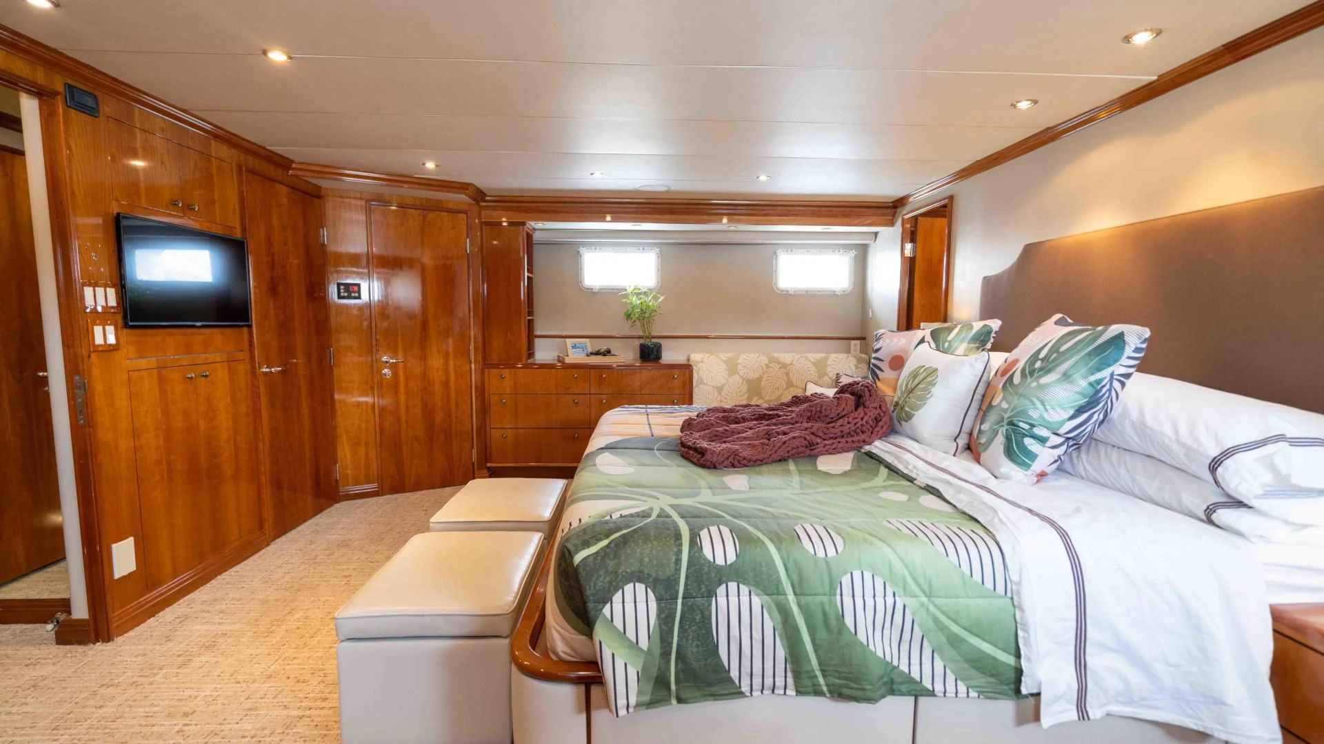a room with a bed and a tv aboard WELL DONE Yacht for Sale