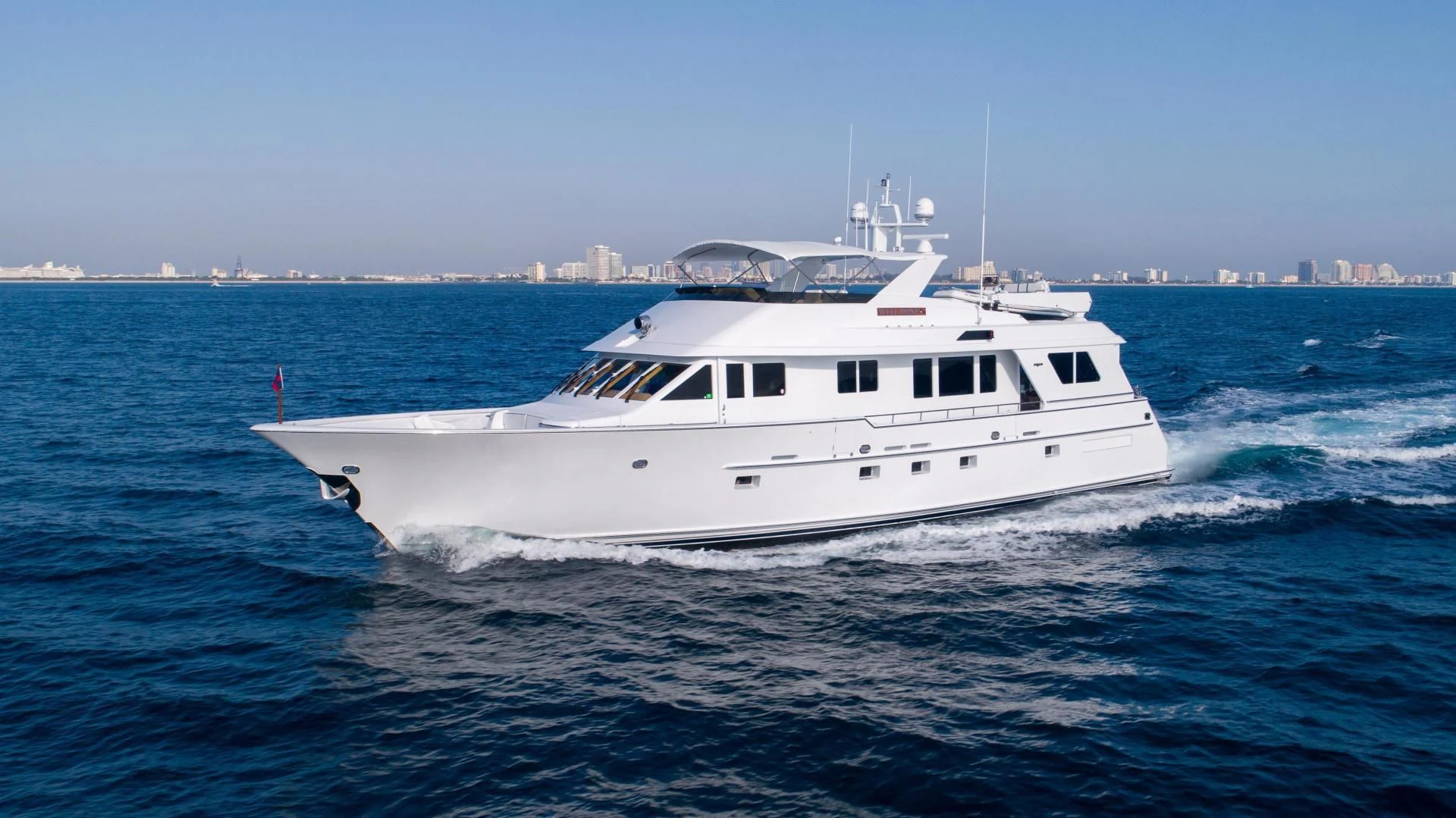a white boat in the water aboard WELL DONE Yacht for Sale