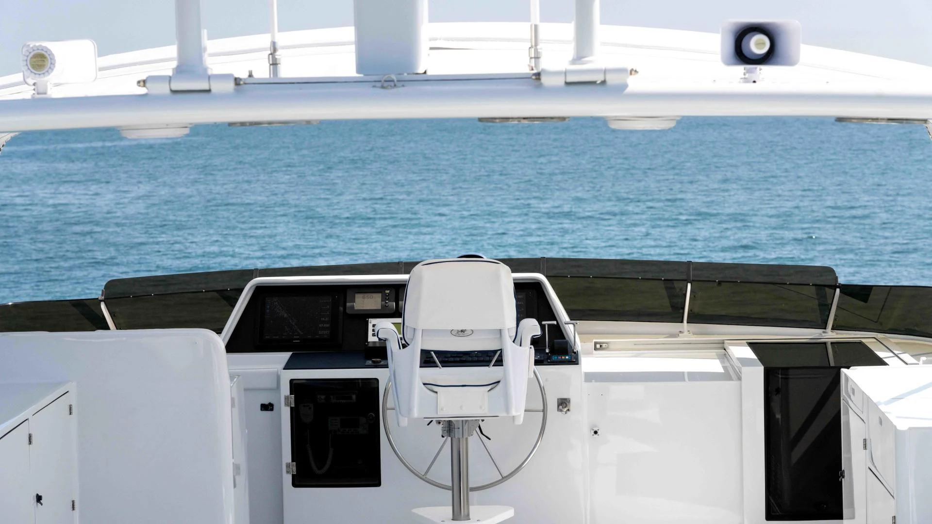 a boat with a deck and a deck and a deck with a view of the water aboard WELL DONE Yacht for Sale