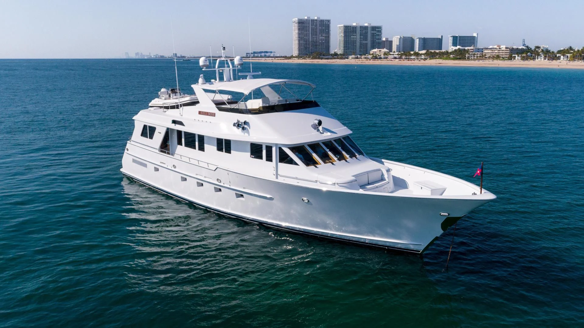 a white boat in the water aboard WELL DONE Yacht for Sale