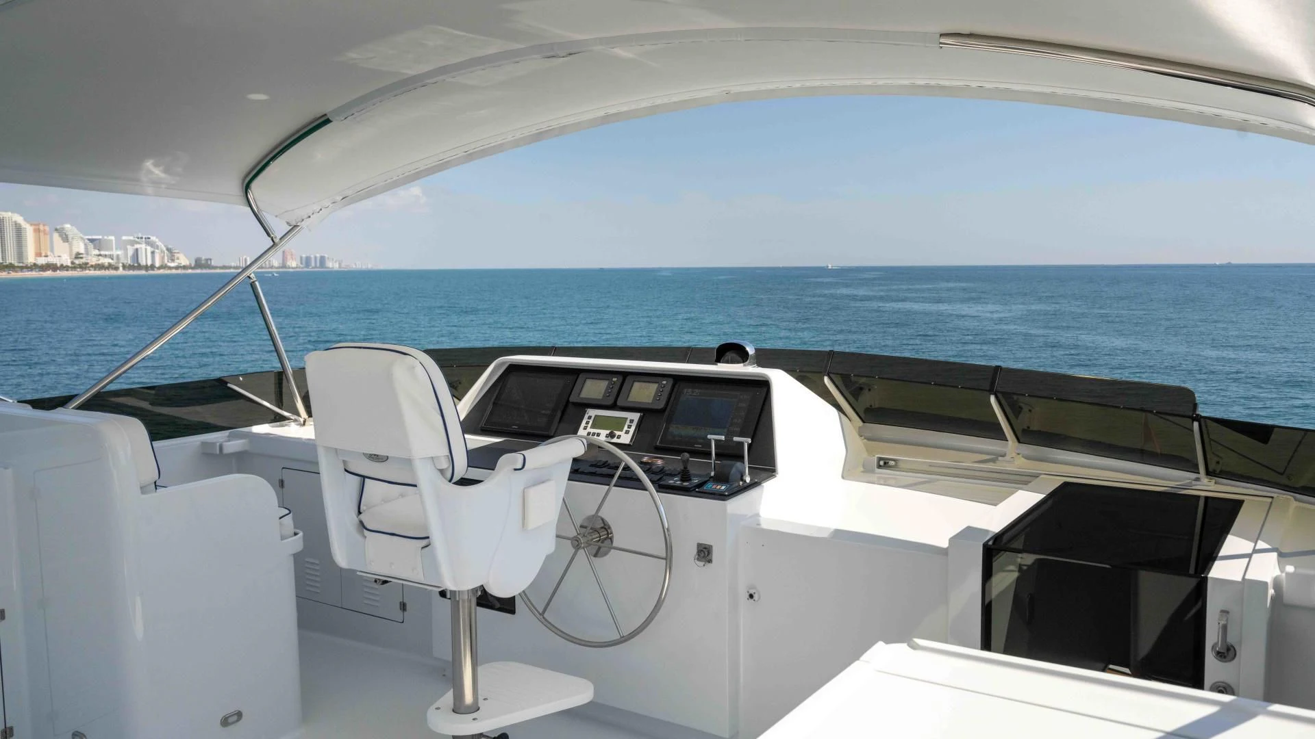 a boat with a chair on the deck aboard WELL DONE Yacht for Sale